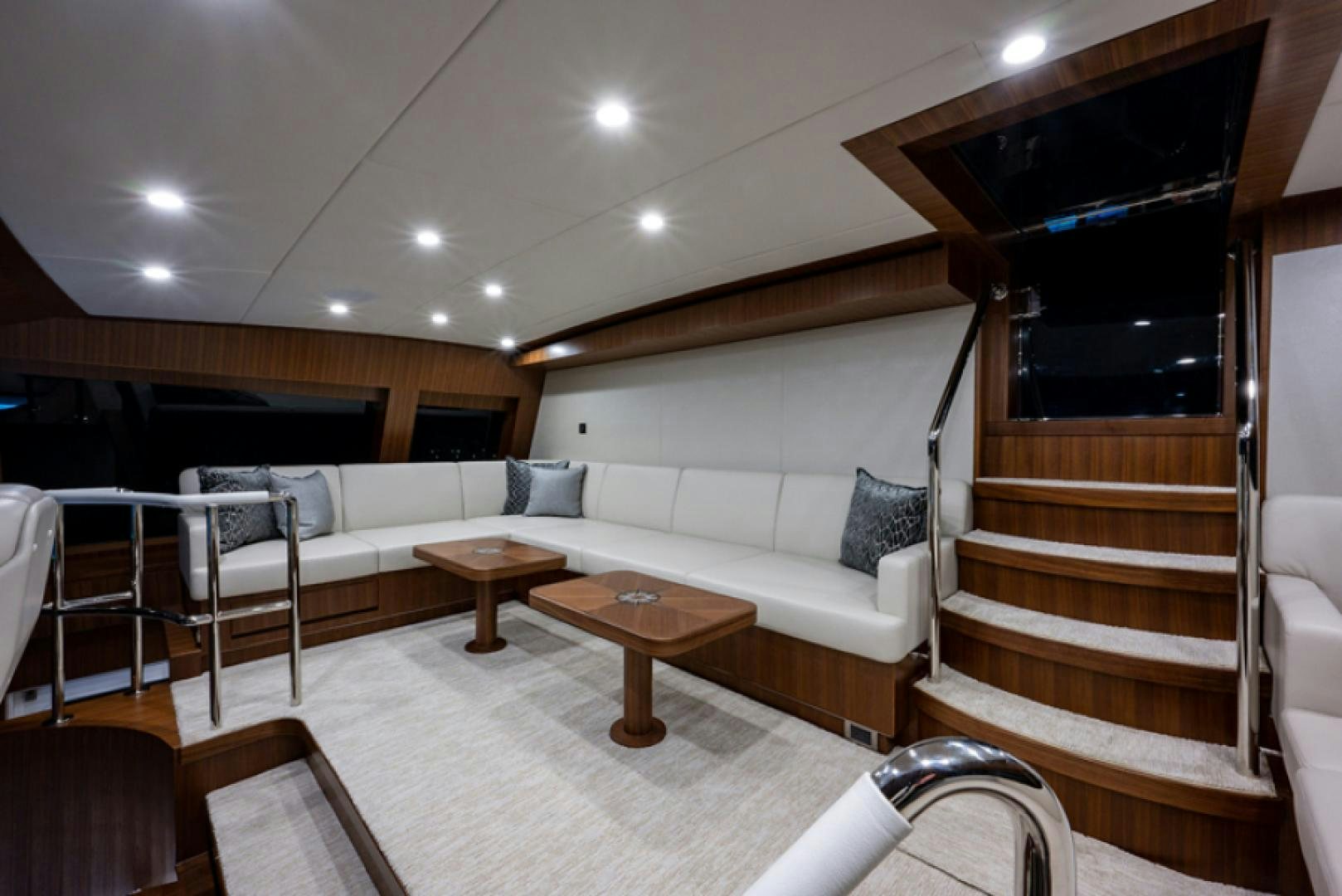 a living room with a couch and a table aboard CONGVOYAGE Yacht for Sale