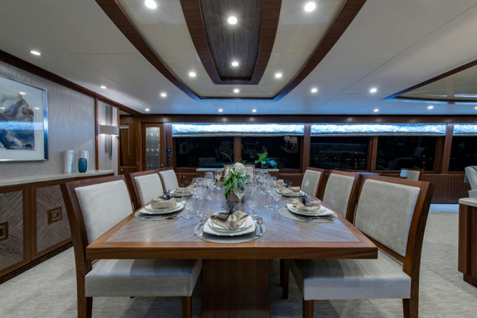 a dining room with a table and chairs aboard CONGVOYAGE Yacht for Sale