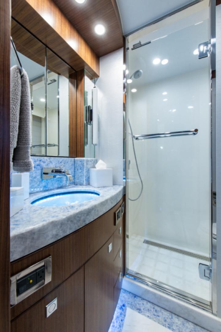 a bathroom with a sink and a mirror aboard CONGVOYAGE Yacht for Sale