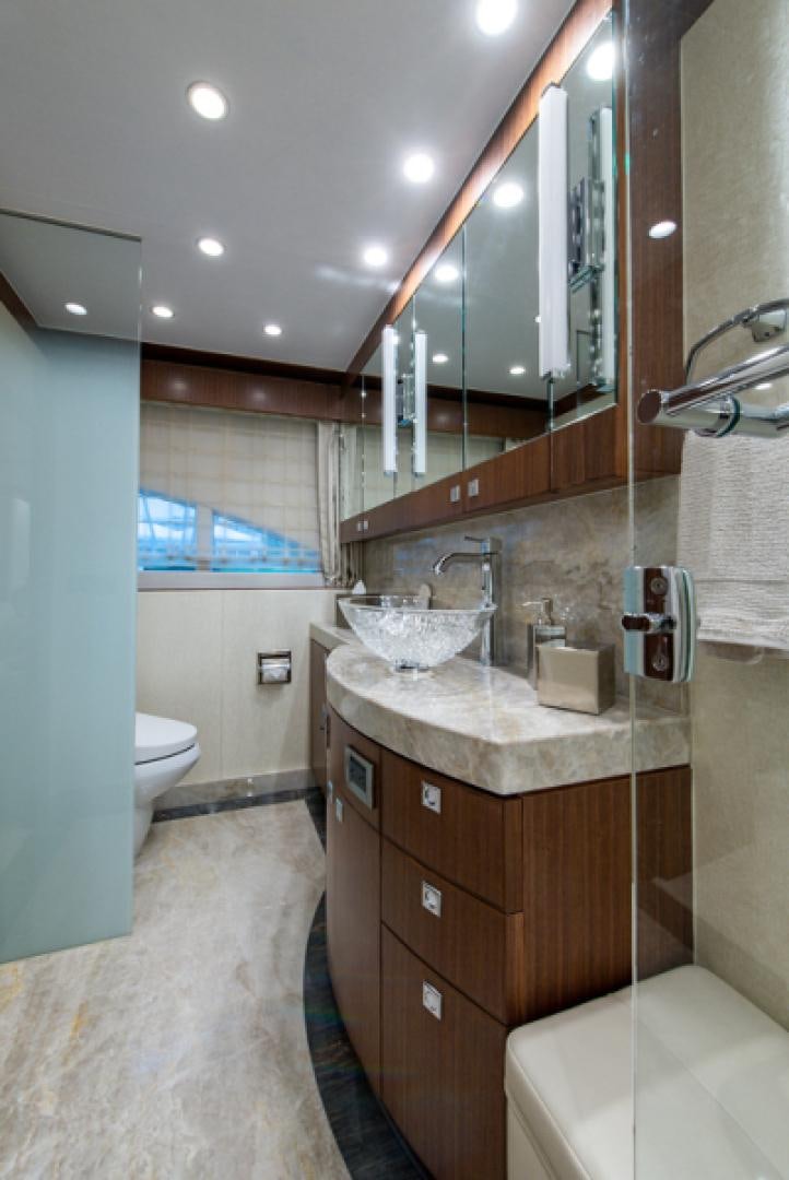 a bathroom with a sink and a mirror aboard CONGVOYAGE Yacht for Sale