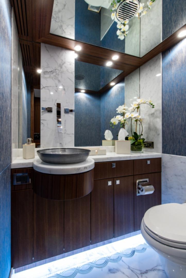 a bathroom with a sink and toilet aboard CONGVOYAGE Yacht for Sale
