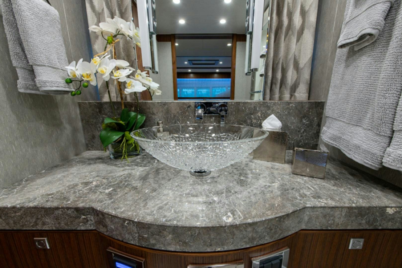 a bathroom sink with a mirror aboard CONGVOYAGE Yacht for Sale