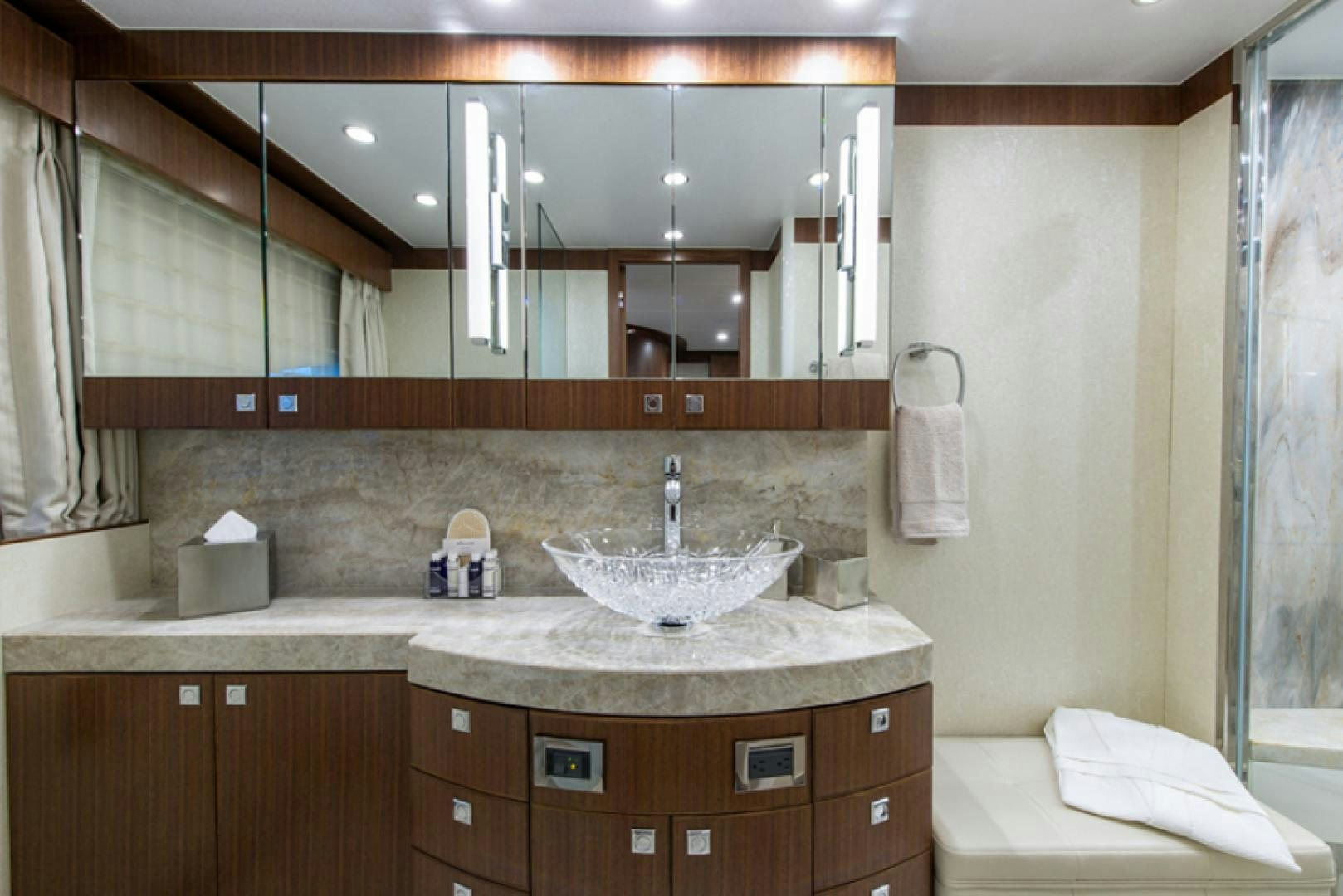 a bathroom with a sink and a mirror aboard CONGVOYAGE Yacht for Sale
