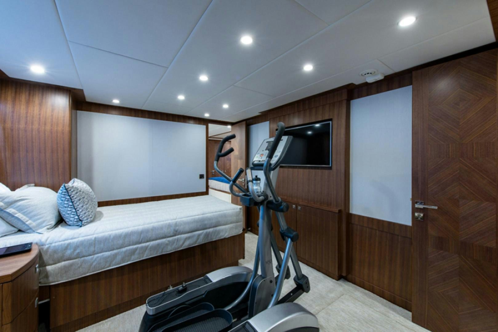 a room with a bed and a television aboard CONGVOYAGE Yacht for Sale