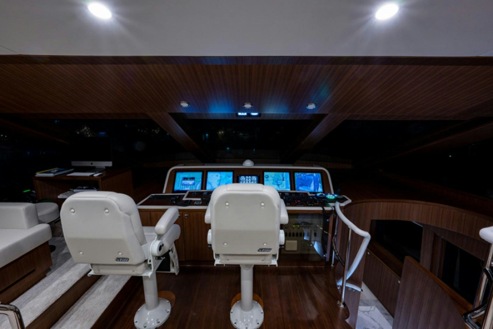 a room with a desk and chairs aboard CONGVOYAGE Yacht for Sale