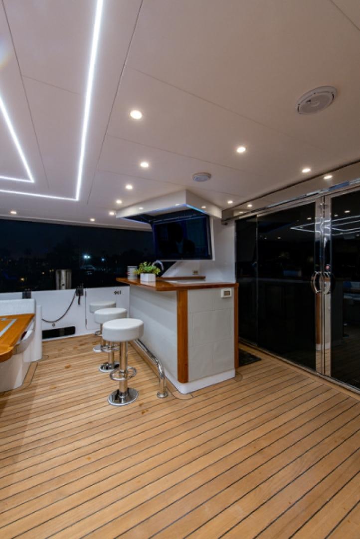 a kitchen with a wood floor aboard CONGVOYAGE Yacht for Sale