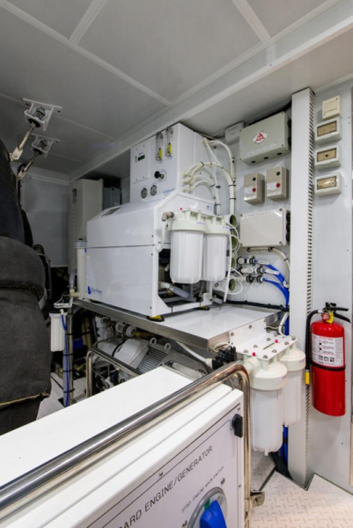 a room with white machines aboard CONGVOYAGE Yacht for Sale