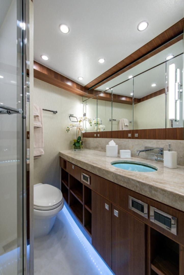 a bathroom with a sink and a toilet aboard CONGVOYAGE Yacht for Sale