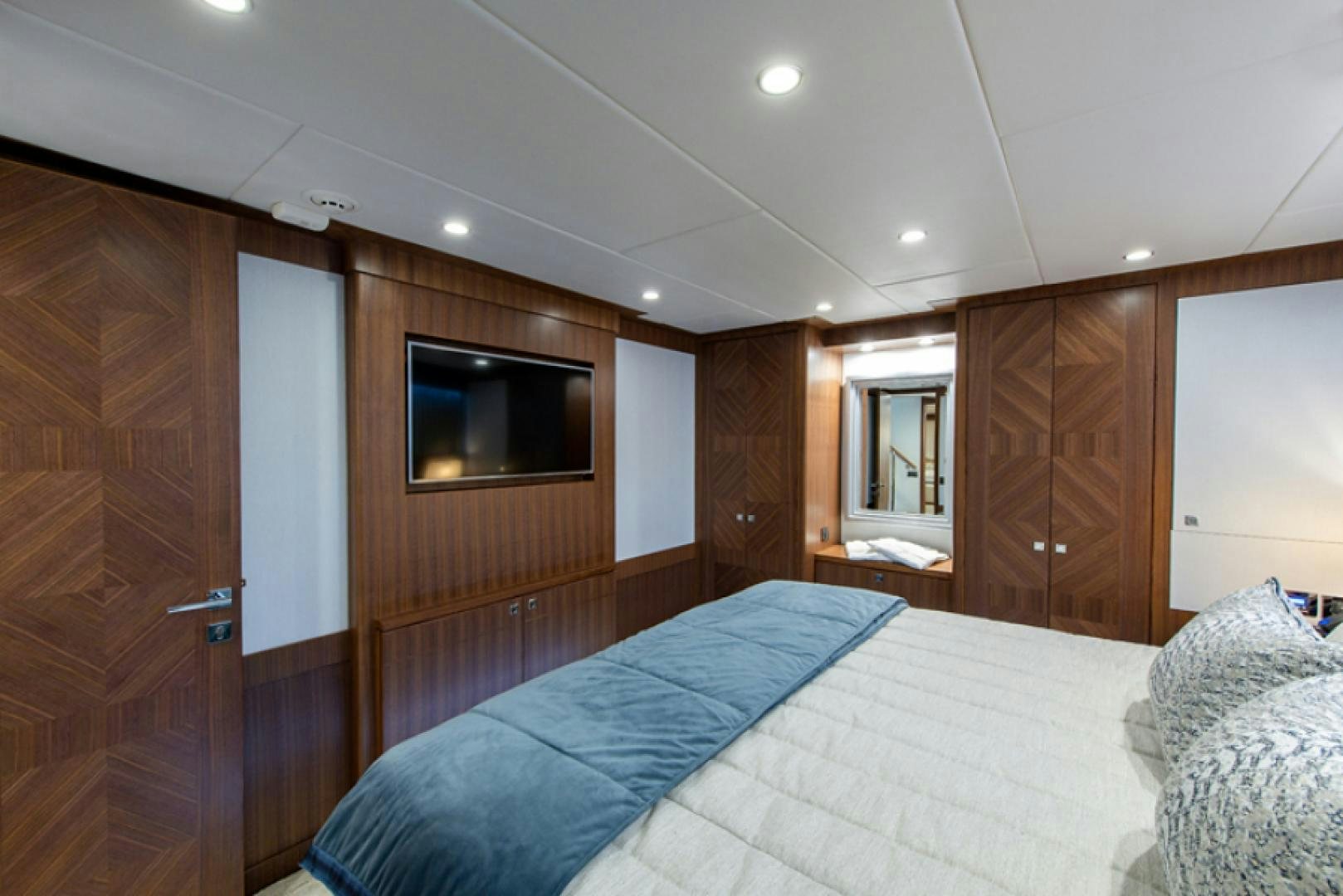 a bedroom with a bed and a television aboard CONGVOYAGE Yacht for Sale
