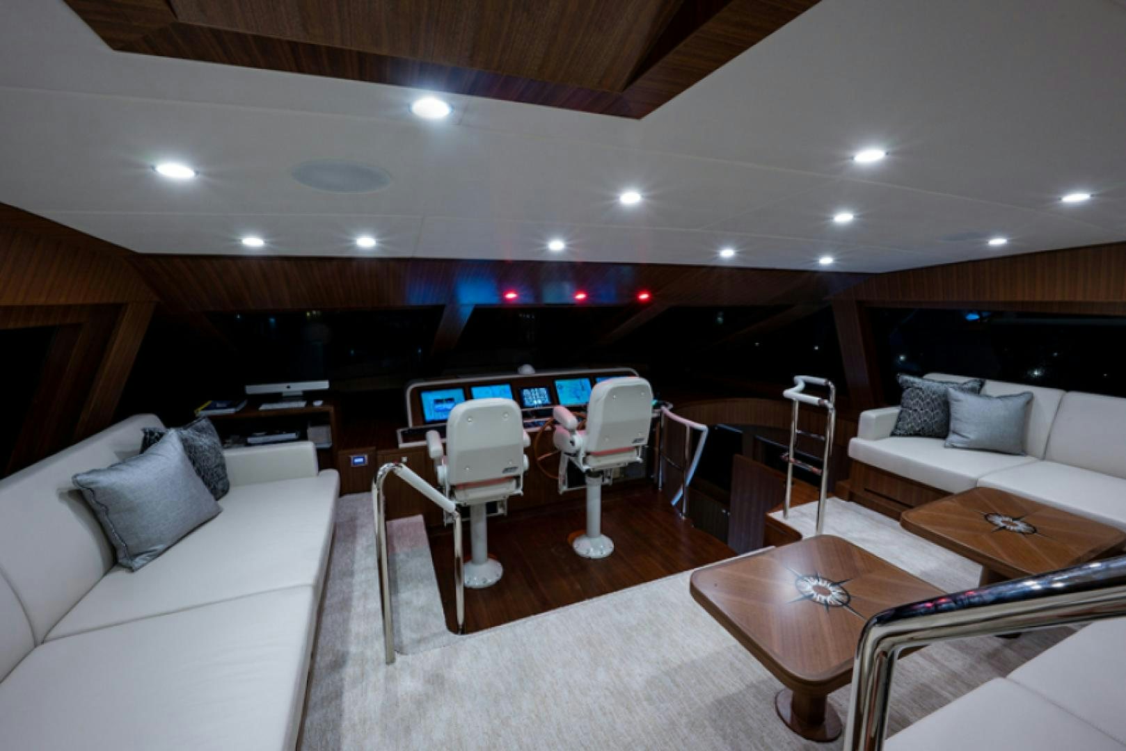 a living room with a table and chairs aboard CONGVOYAGE Yacht for Sale