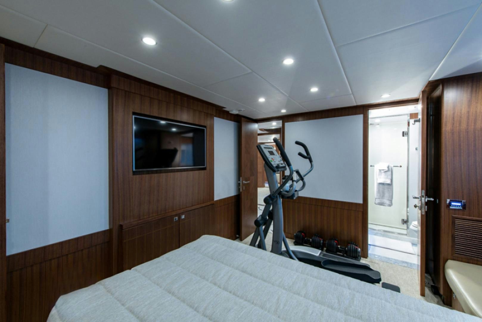 a bedroom with a bed and a television aboard CONGVOYAGE Yacht for Sale
