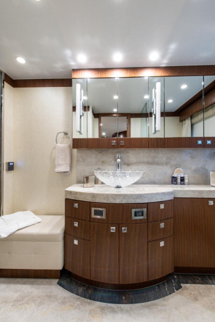 a bathroom with a sink and a mirror aboard CONGVOYAGE Yacht for Sale