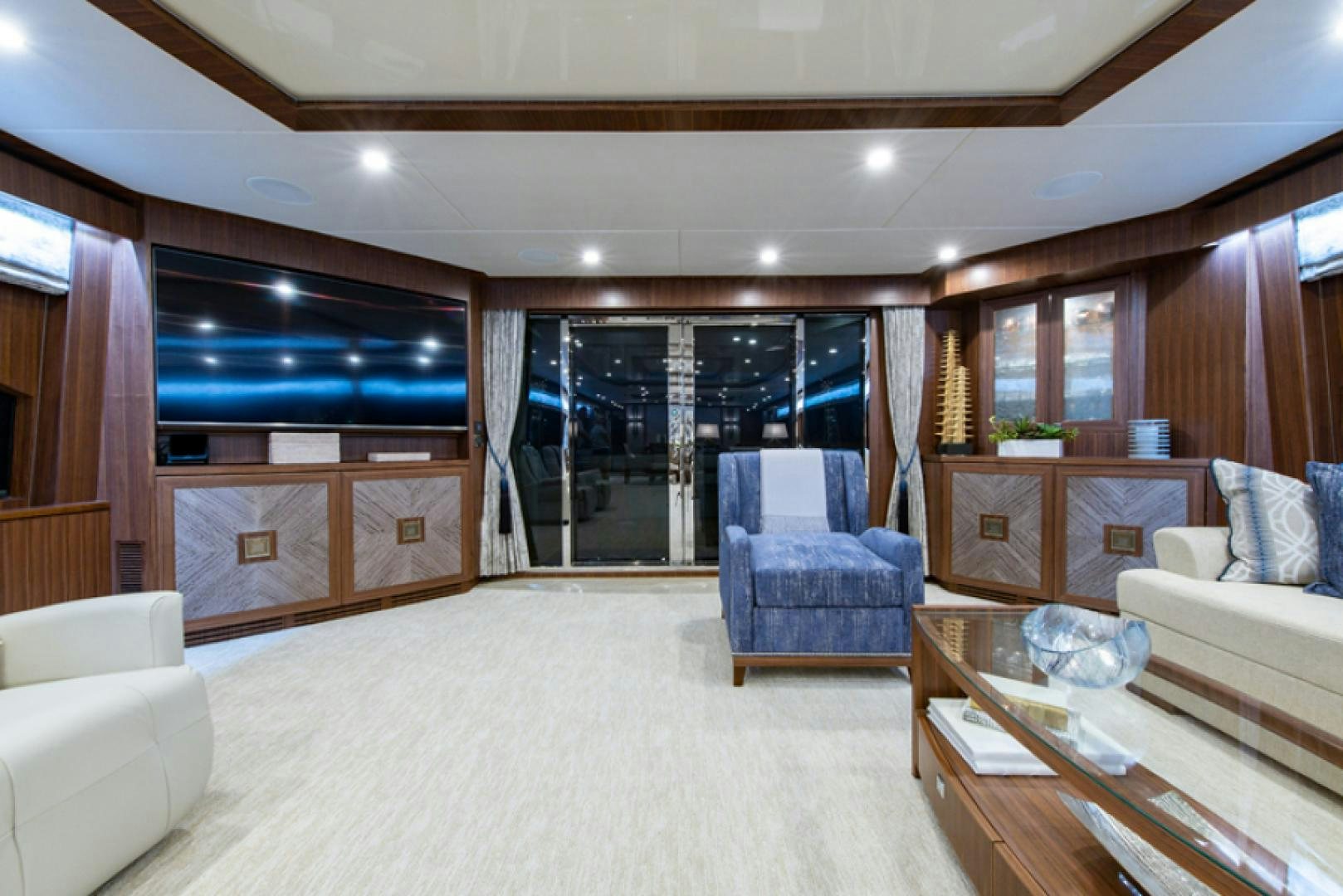 a living room with a large window aboard CONGVOYAGE Yacht for Sale
