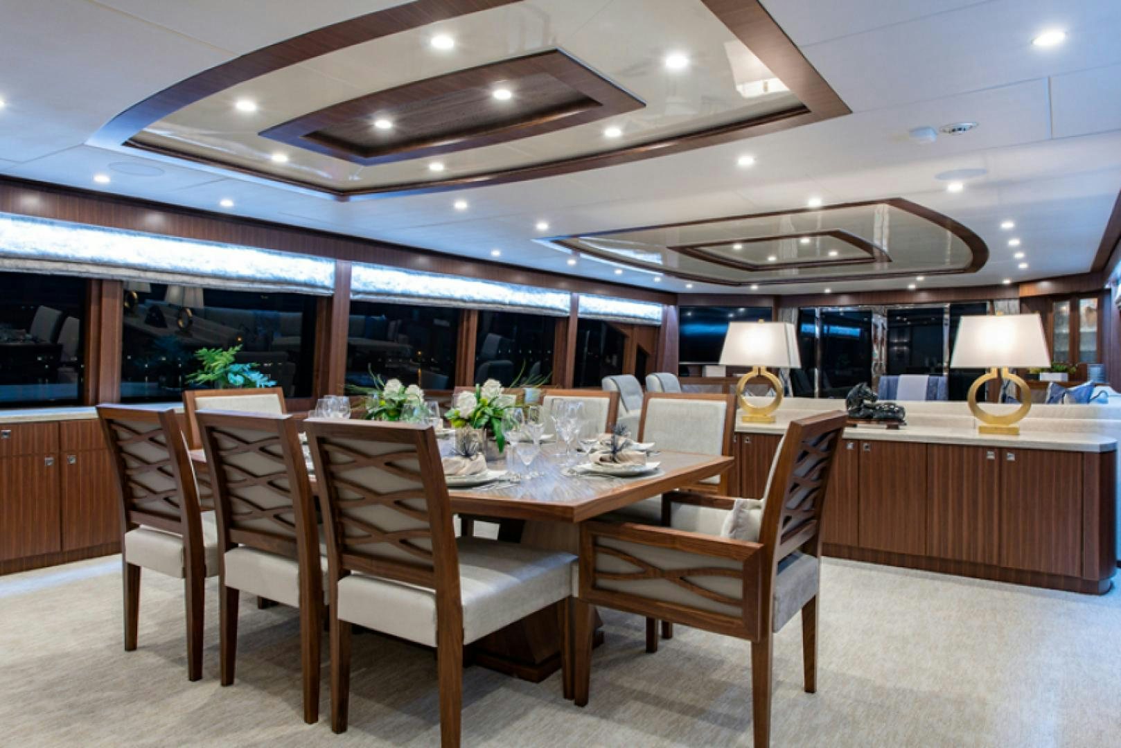 a dining room with a table and chairs aboard CONGVOYAGE Yacht for Sale