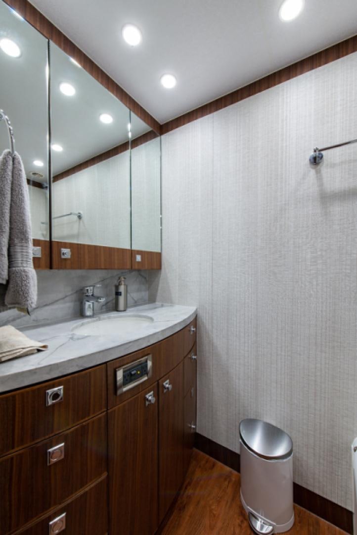 a bathroom with a sink and a mirror aboard CONGVOYAGE Yacht for Sale