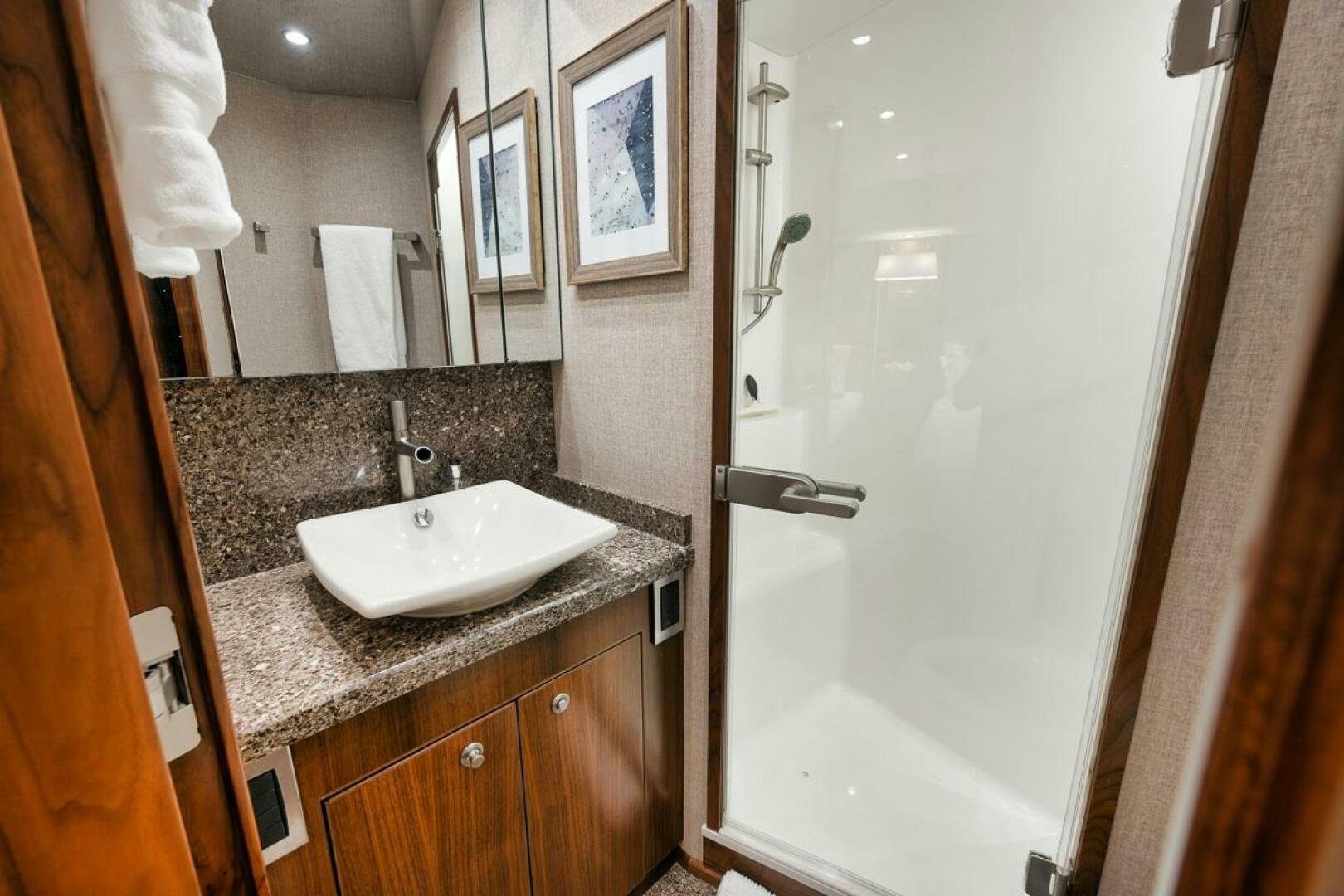 a bathroom with a sink and a mirror aboard FA-LA-ME Yacht for Sale