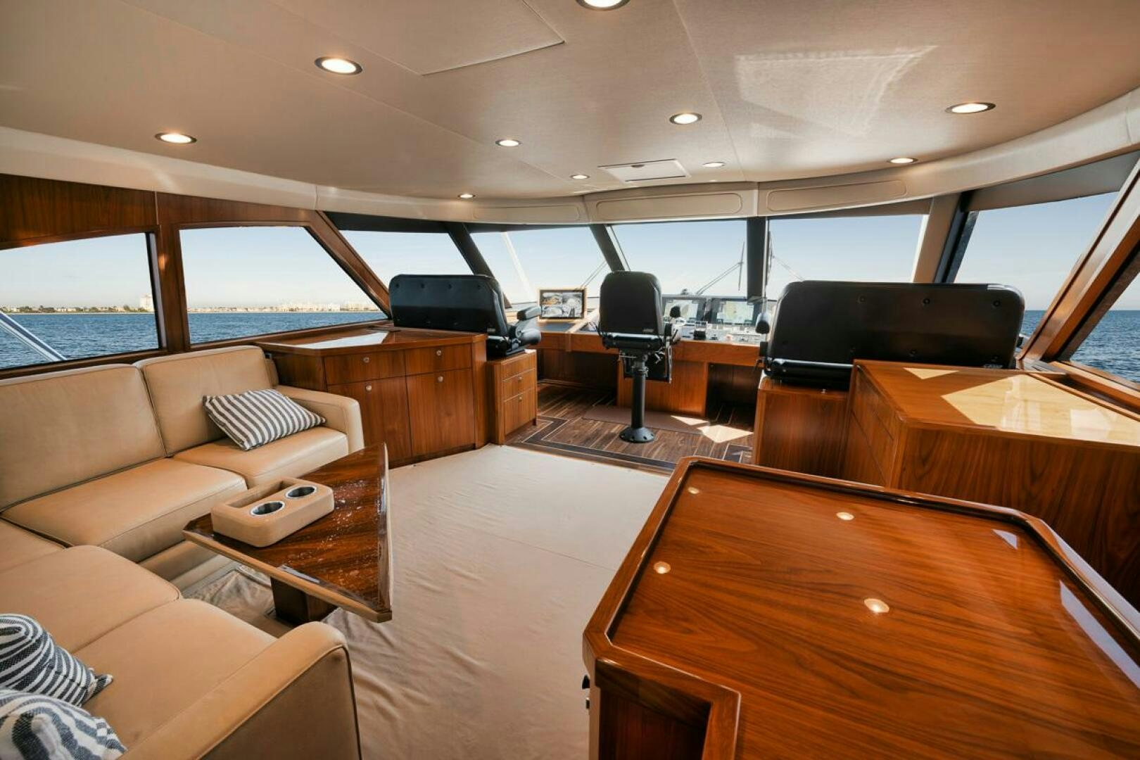 a room with a couch and a table and a television aboard FA-LA-ME Yacht for Sale