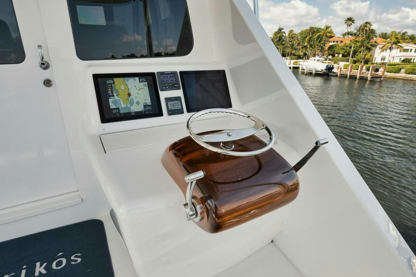 a boat with a steering wheel and a steering wheel on the front aboard FA-LA-ME Yacht for Sale
