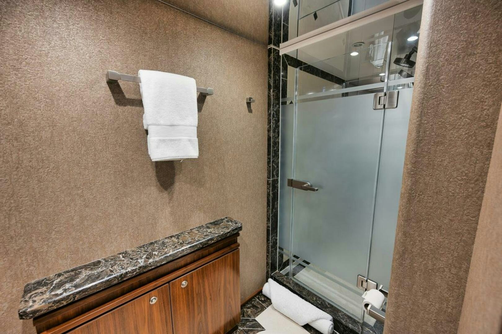 a bathroom with a shower unit and a sink aboard FA-LA-ME Yacht for Sale