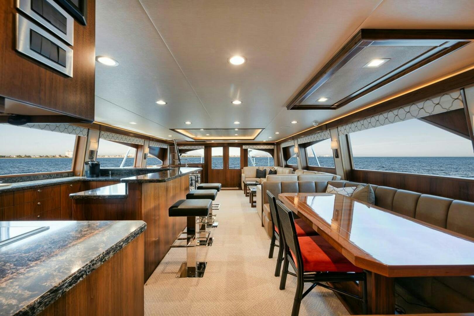 a room with tables and chairs aboard FA-LA-ME Yacht for Sale