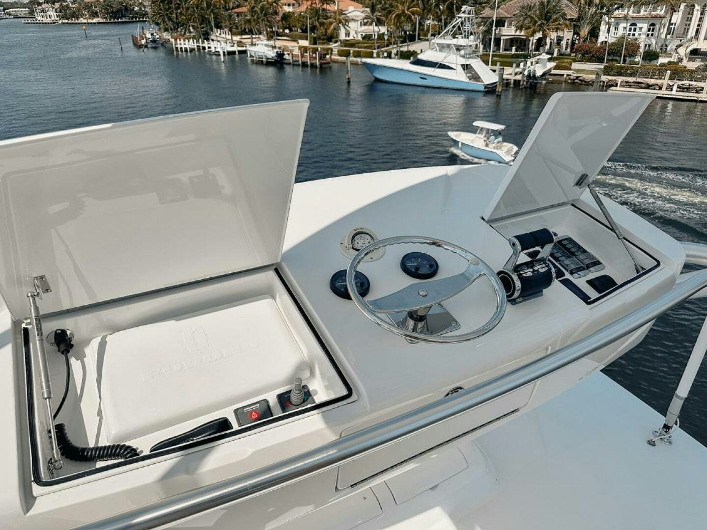 a white boat with a steering wheel aboard FA-LA-ME Yacht for Sale