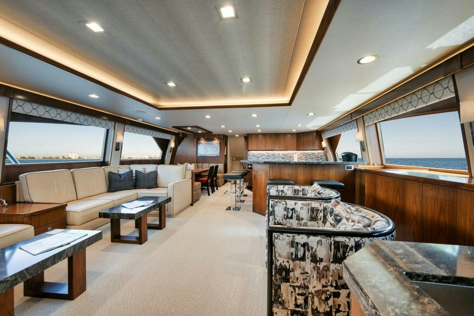 a large living room with a large window aboard FA-LA-ME Yacht for Sale