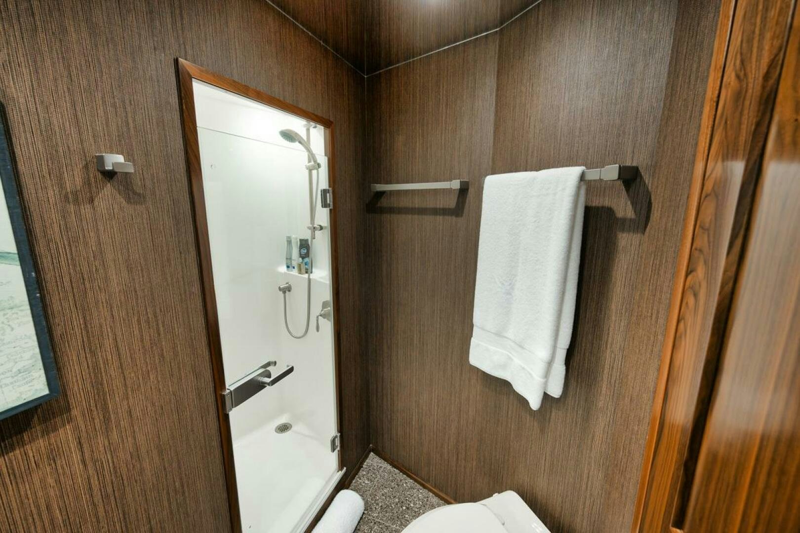 a bathroom with a mirror and towels aboard FA-LA-ME Yacht for Sale