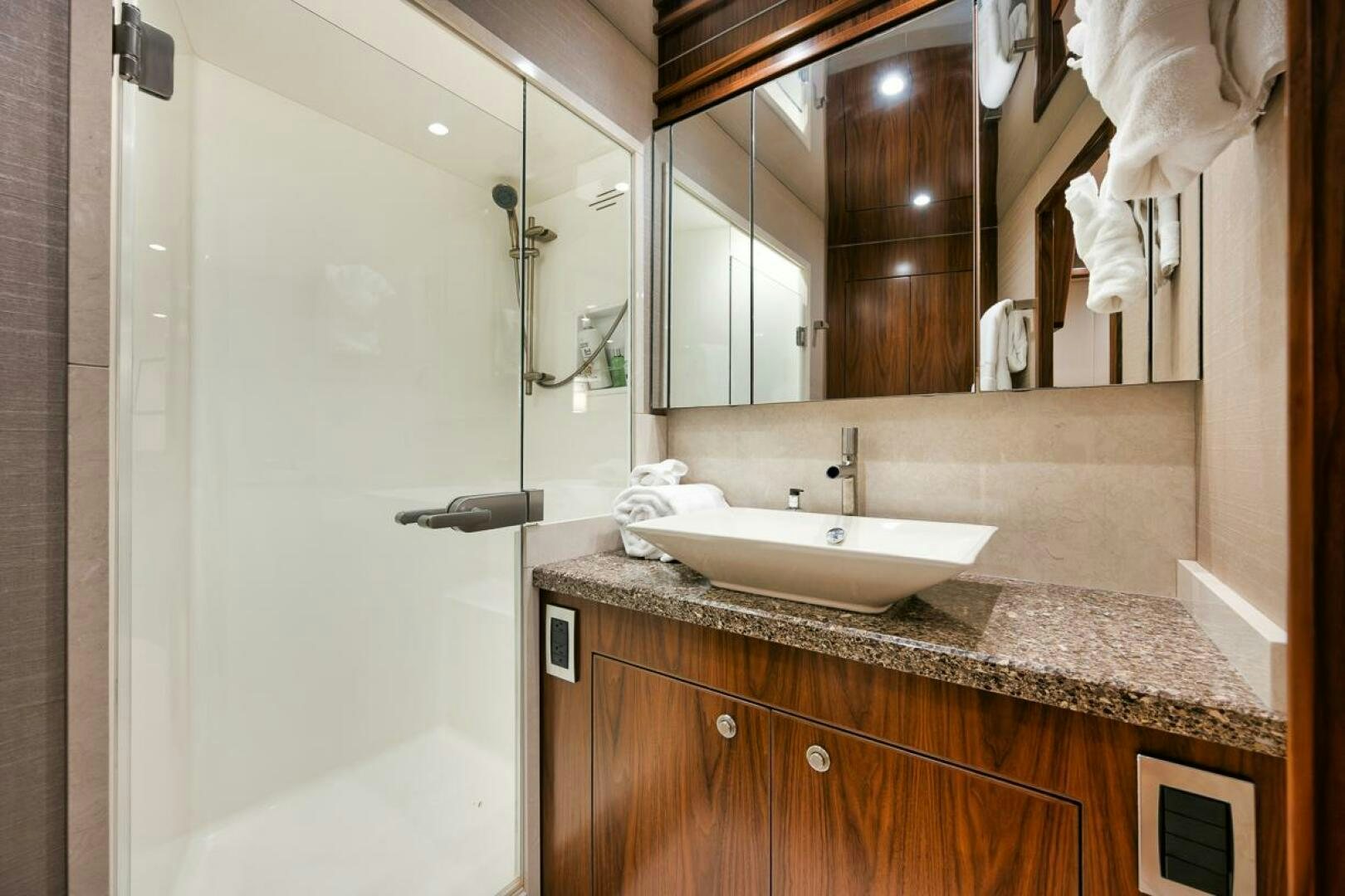 a bathroom with a sink and a mirror aboard FA-LA-ME Yacht for Sale