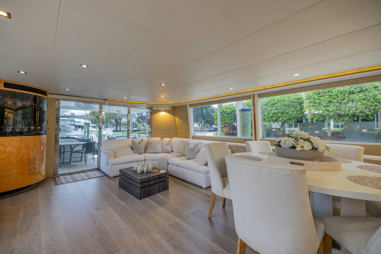 a living room with a large window aboard BOURBON LEGEND Yacht for Sale