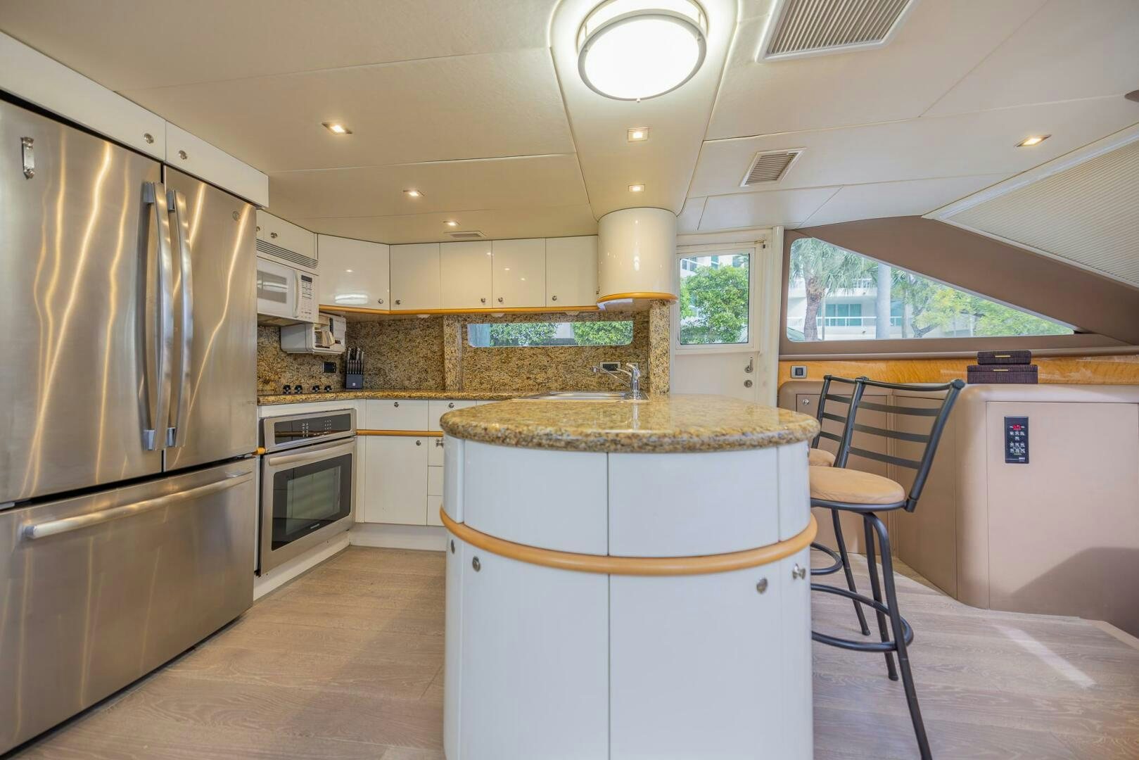 a kitchen with a large island aboard BOURBON LEGEND Yacht for Sale