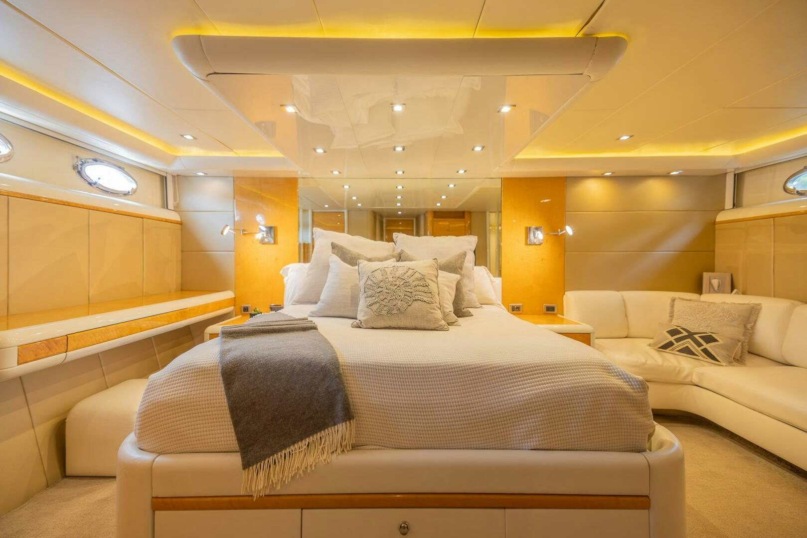 a room with a bed and a couch aboard BOURBON LEGEND Yacht for Sale