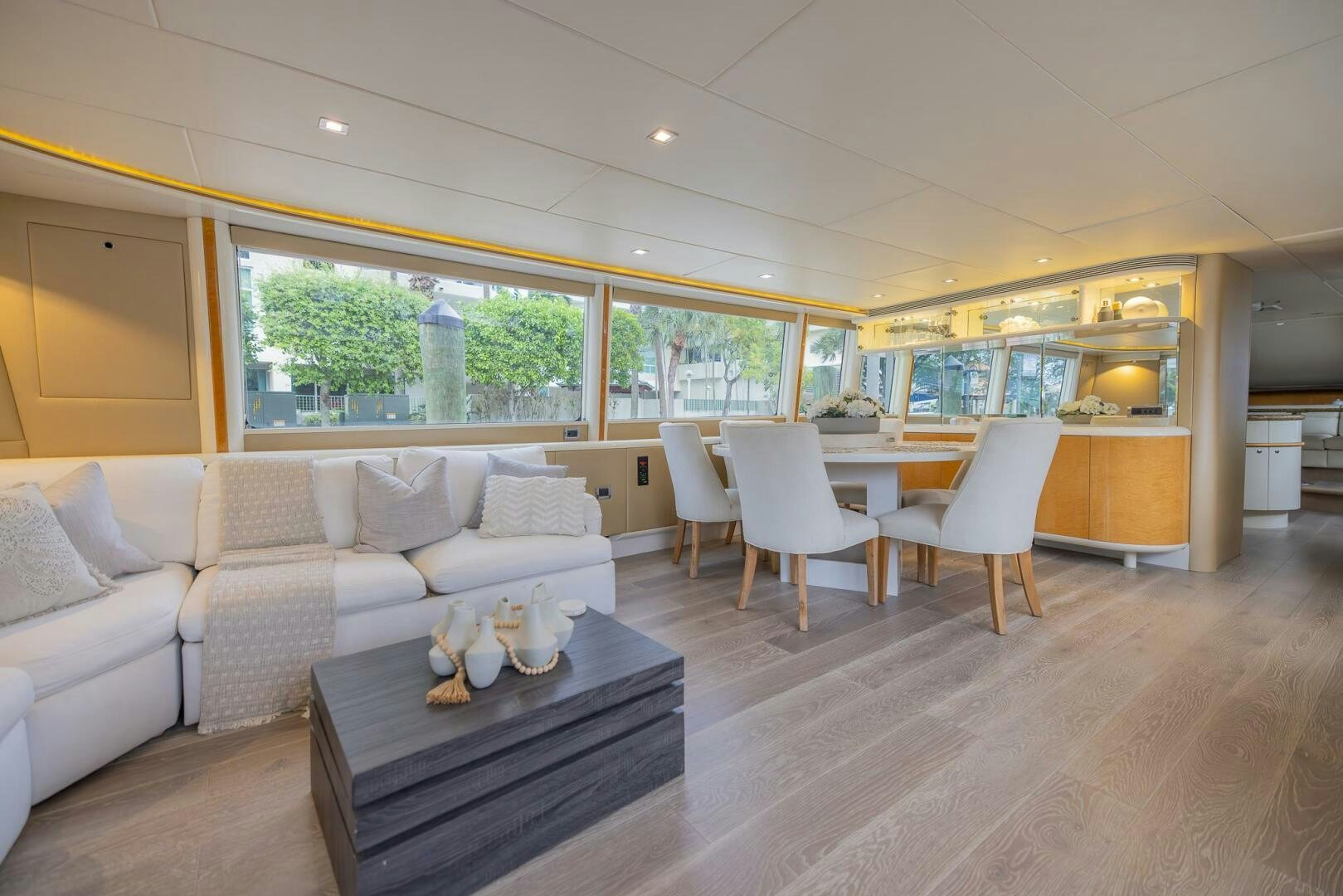 a living room with a couch and a table aboard BOURBON LEGEND Yacht for Sale