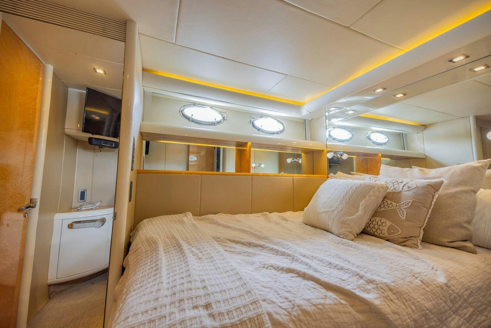 a bed with white sheets aboard BOURBON LEGEND Yacht for Sale