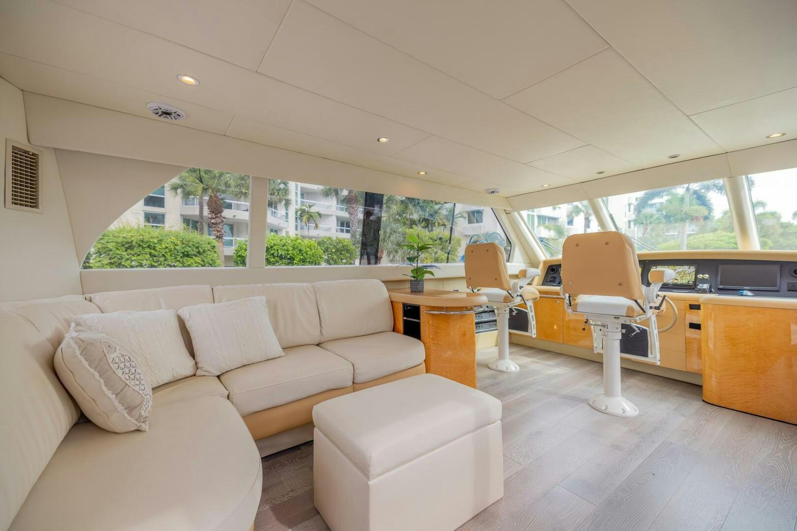 a living room with a couch and a table aboard BOURBON LEGEND Yacht for Sale