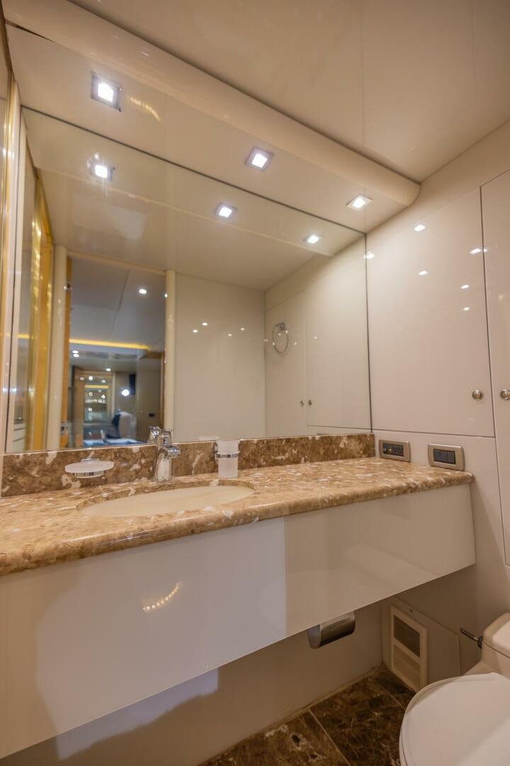 a bathroom with a large mirror aboard BOURBON LEGEND Yacht for Sale
