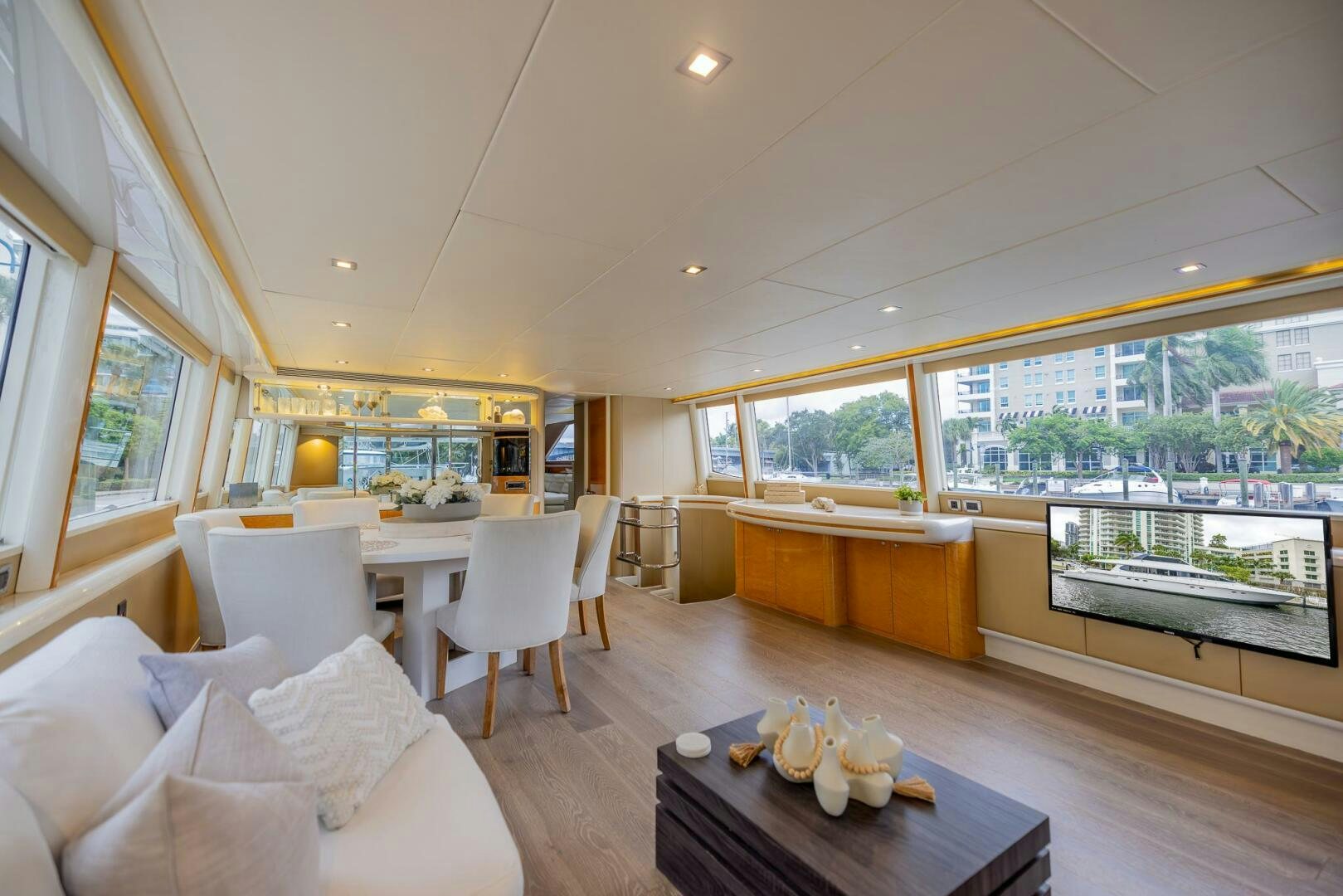 a living room with a large window aboard BOURBON LEGEND Yacht for Sale