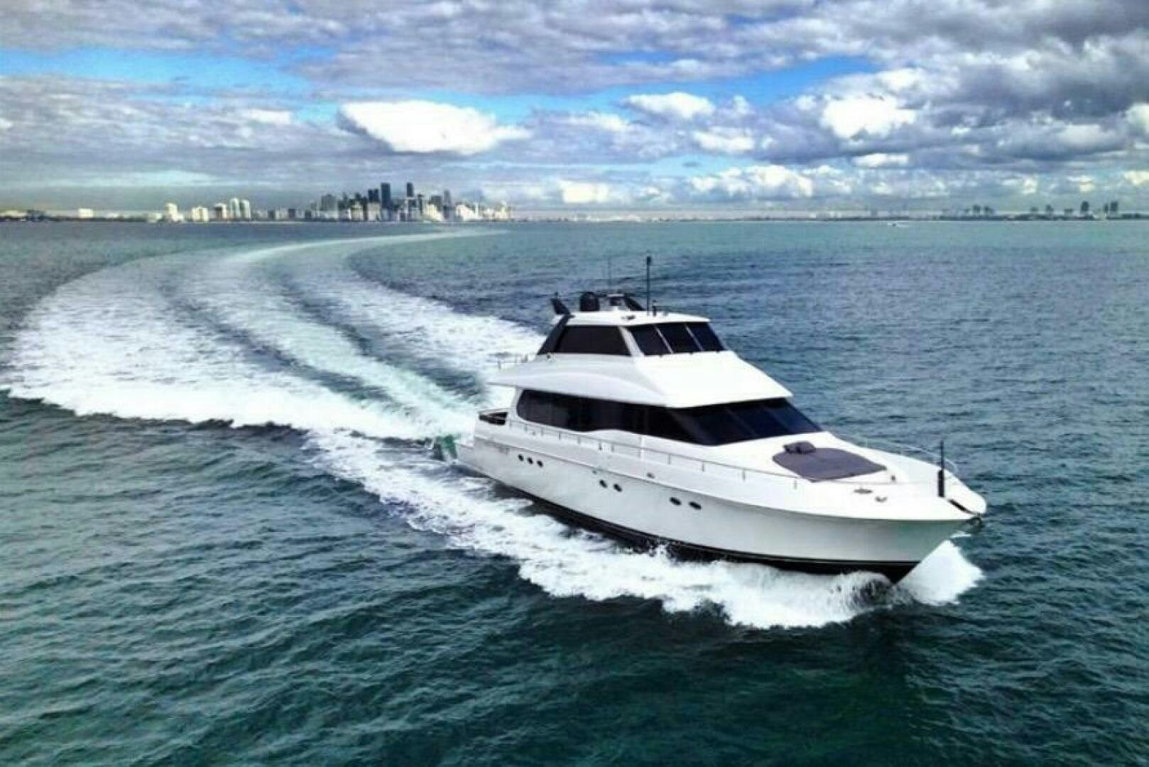 a white boat on the water aboard BOURBON LEGEND Yacht for Sale