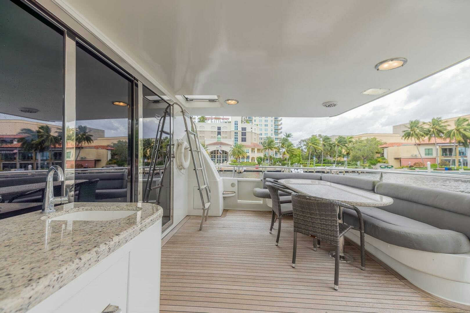 a room with a table and chairs aboard BOURBON LEGEND Yacht for Sale