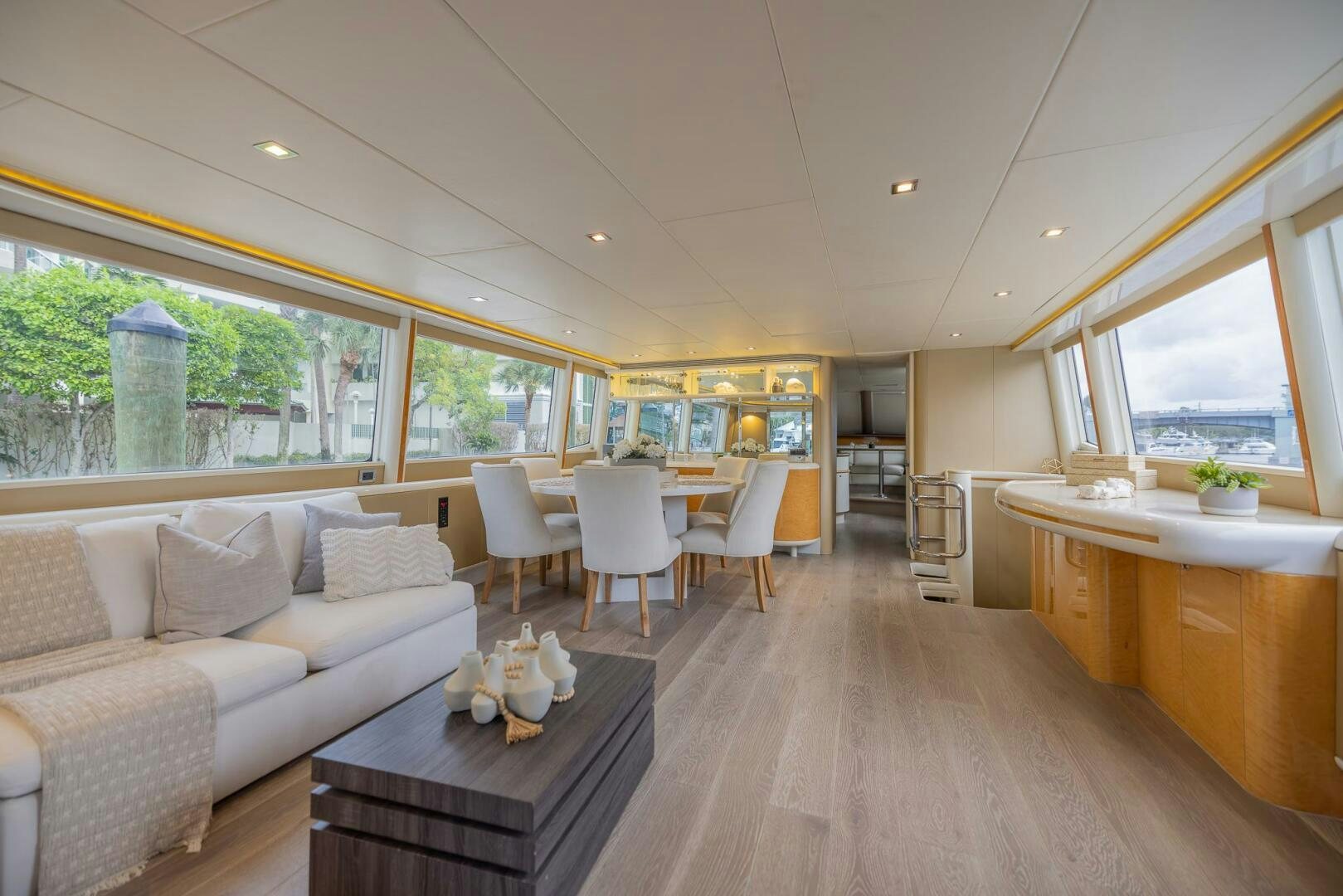 a living room with a wood floor aboard BOURBON LEGEND Yacht for Sale