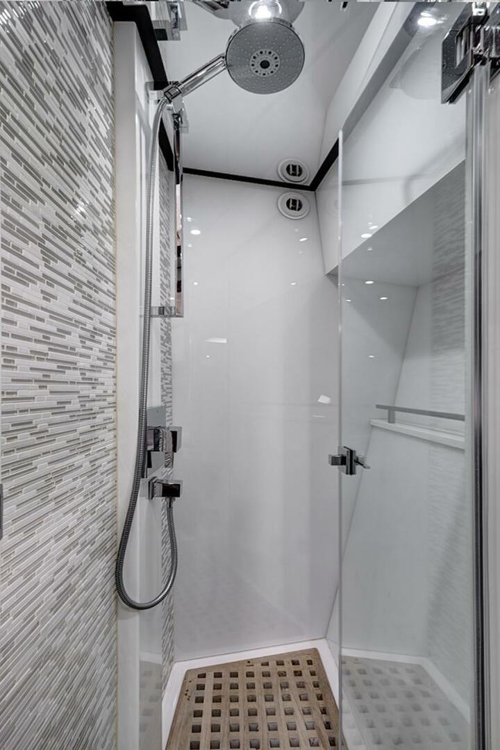 a white door with a light on it aboard DREAM Yacht for Sale