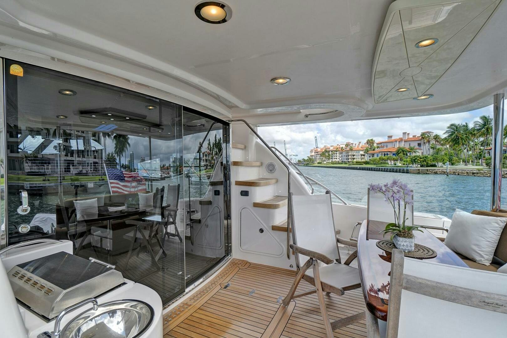 a boat with a table and chairs aboard DREAM Yacht for Sale