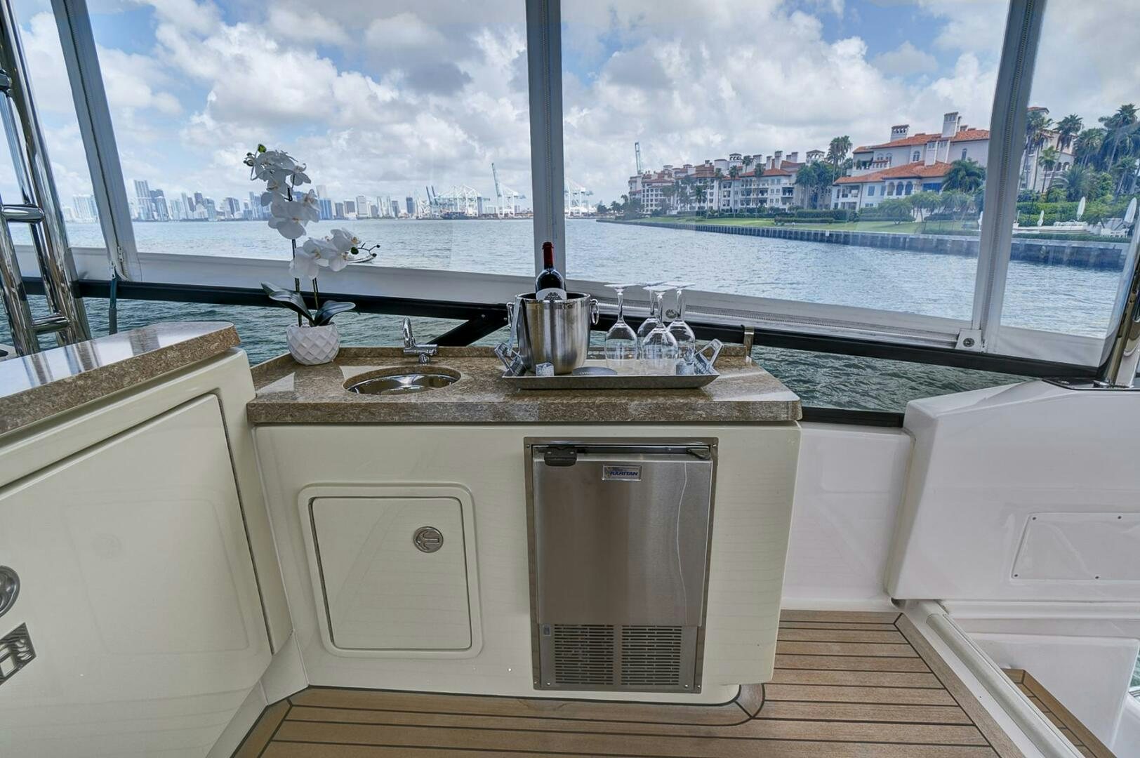 a kitchen with a window aboard DREAM Yacht for Sale
