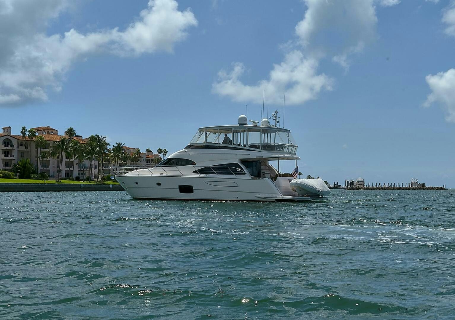 a white boat in the water aboard DREAM Yacht for Sale