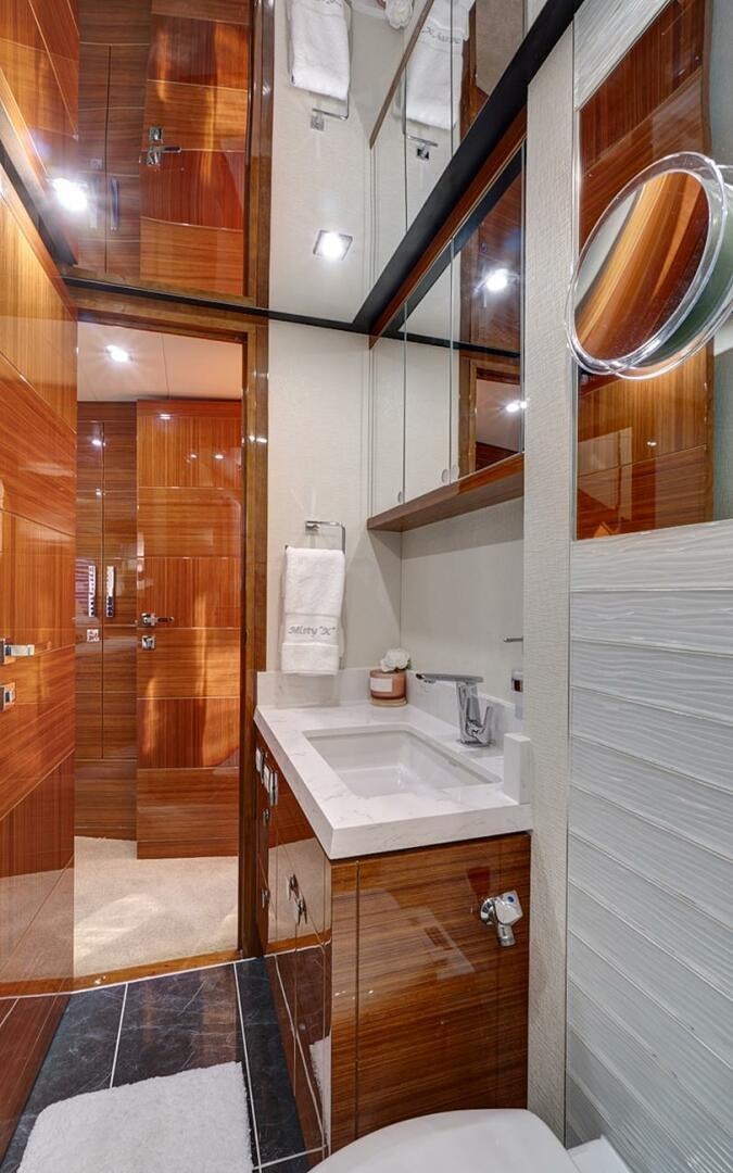 a bathroom with a sink and a mirror aboard DREAM Yacht for Sale