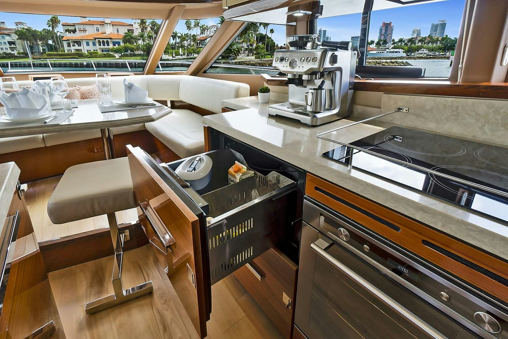 a kitchen with a table and chairs aboard DREAM Yacht for Sale