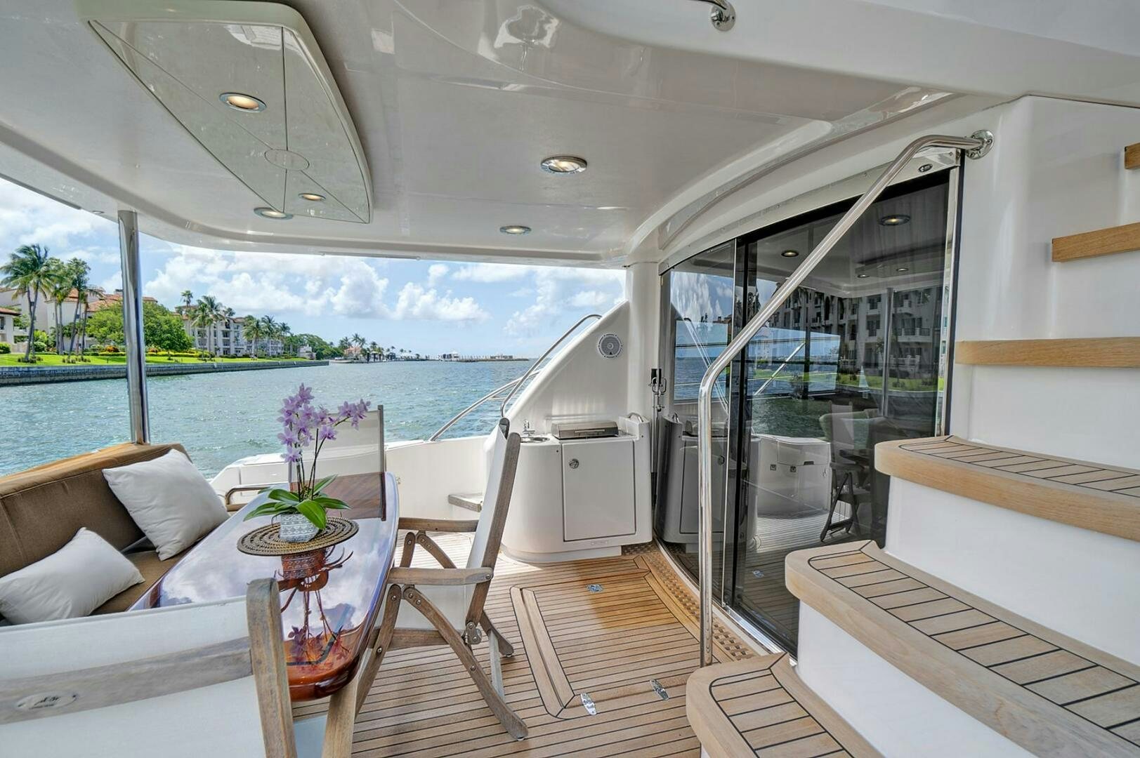 a boat with a table and chairs aboard DREAM Yacht for Sale