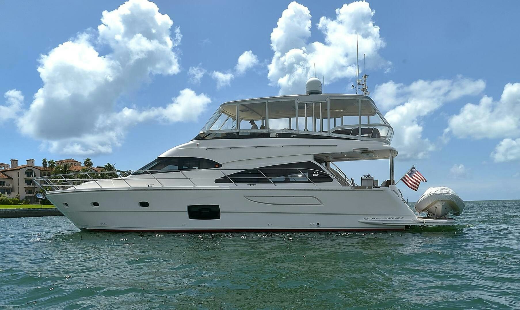 a large white yacht in the water aboard DREAM Yacht for Sale