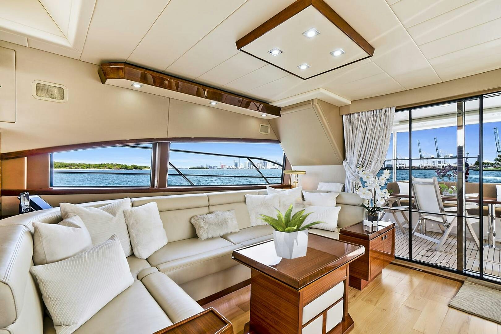 a living room with a large window aboard DREAM Yacht for Sale