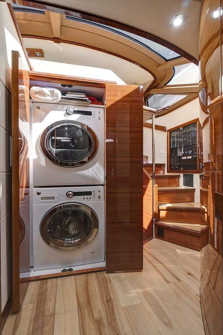 a room with a washer and dryer aboard DREAM Yacht for Sale