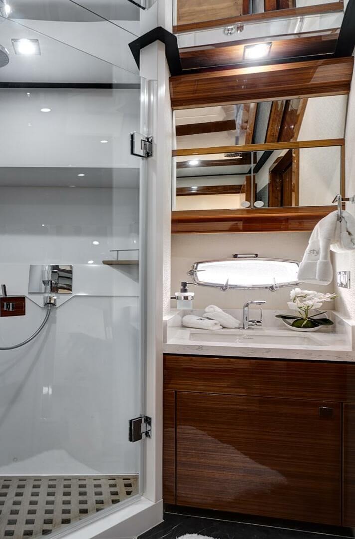 a bathroom with a shower and sink aboard DREAM Yacht for Sale